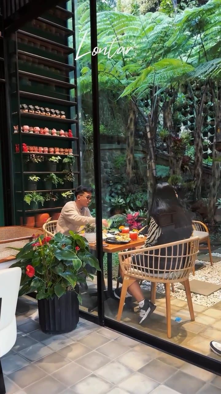 Garden-side seating at Lontar Coffee Corner