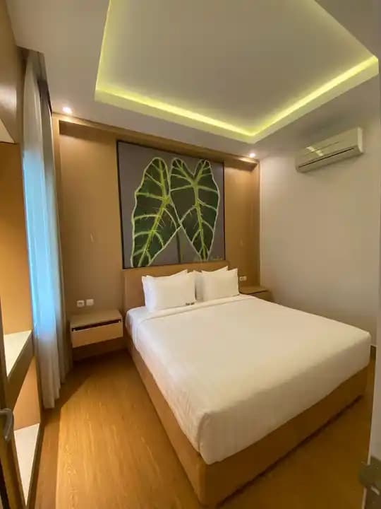 Executive room with warm timber finishes and oversized leaf artwork