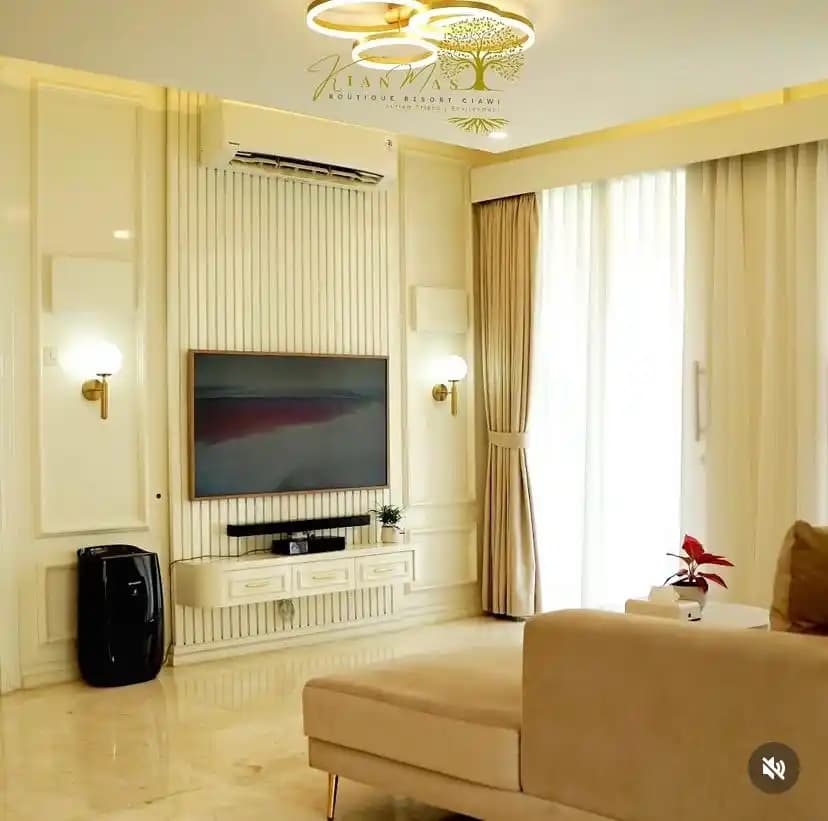 Cream suite living room with television and window light